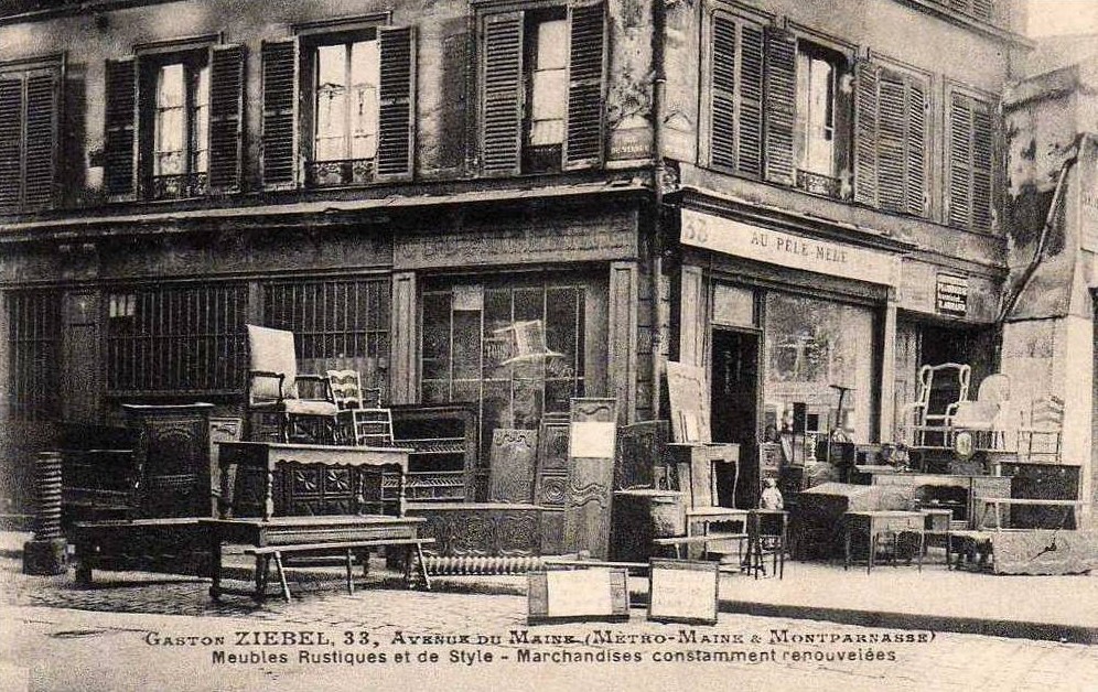 Carte postale du commerce "Au Pêle-mêle" situé au 33 avenue du Maine, à l'angle de la rue du Viaduc.